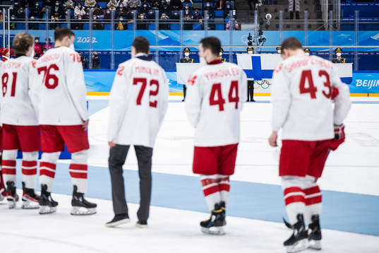 The flag of Finland is shown behind players of Russia