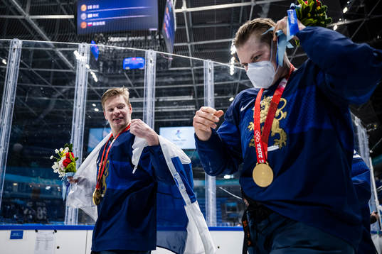 Players of Finland celebrate with their gold medals