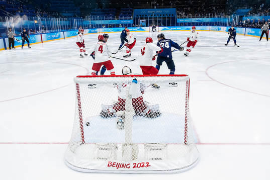 Hannes Björninen of Finland scores 2-1 behind goaltender