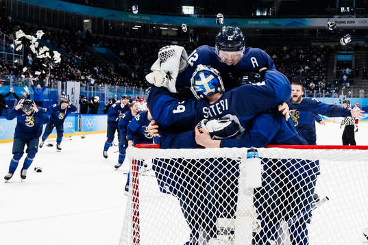Marko Anttila of Finland celebrate with goaltender Harri