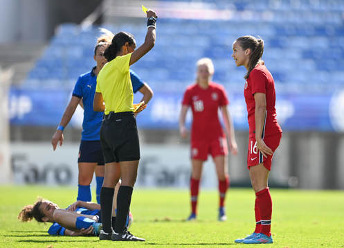 Guro Reiten of Norway is shown a yellow card