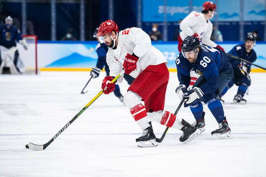 Vyacheslav Voynov of Russia and Markus Granlund of Finland