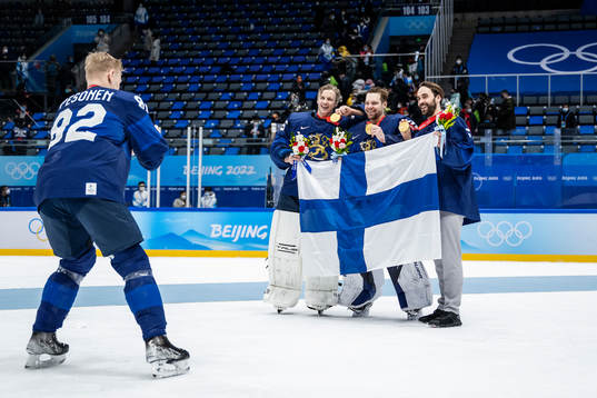 Harri Pesonen of Finland takes a photo of goaltenders Jussi