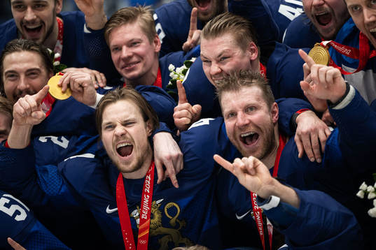 Mikko Lehtonen and Leo Komarov of Finland celebrate with