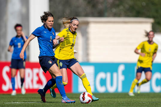 Elena Linari of Italy and Kosovare Asllani of Sweden