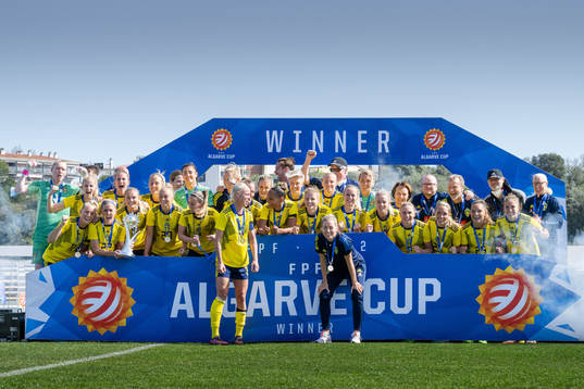 Players of Sweden celebrate with the trophy