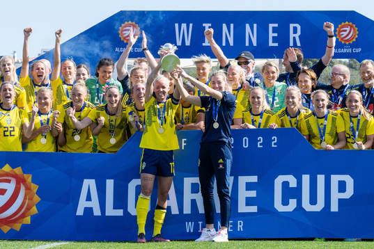 Players of Sweden celebrate with the trophy