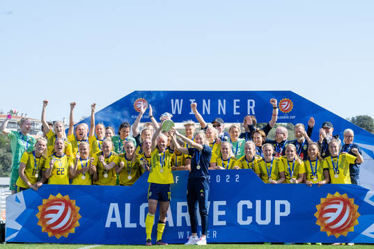 Players of Sweden celebrate with the trophy