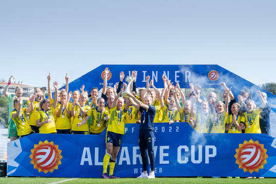 Players of Sweden celebrate with the trophy