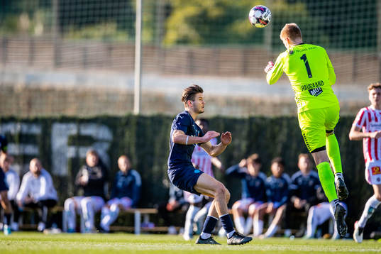 Wilhelm Loeper of Helsingborg and goalkeeper Jakob Haugaard