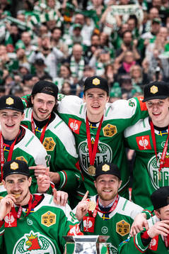 Players of Rögle celebrate with the trophy