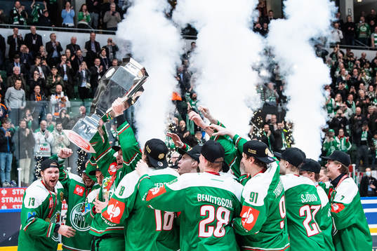 Players of Rögle celebrate with the trophy