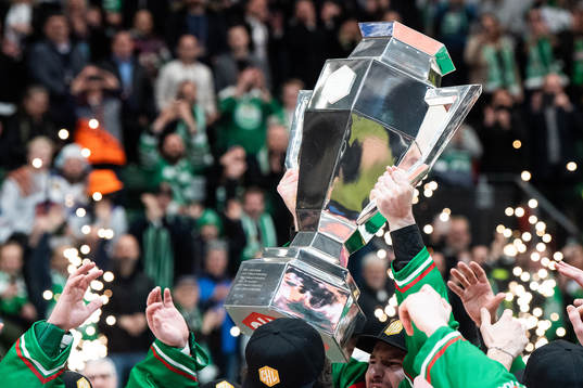 Players of Rögle celebrate with the trophy