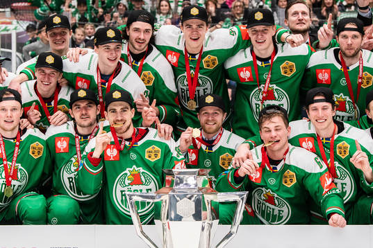 Players of Rögle celebrate with the trophy