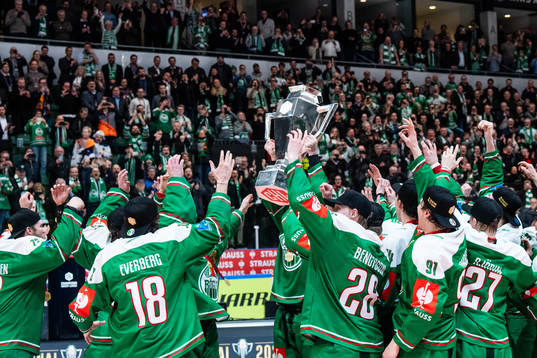 Players of Rögle celebrate with the trophy