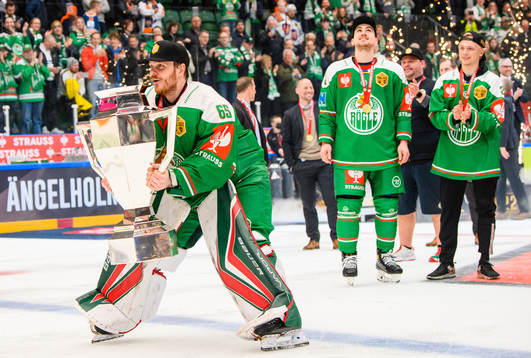 Goalkeeper Christoffer Rifalk of Rögle lifts the trophy