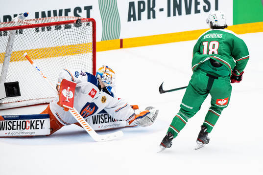 Dennis Everberg of Rögle and goalkeeper Christian Heljanko