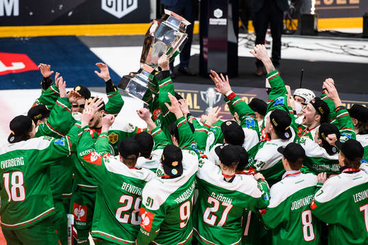 Players of Rögle celebrate with the trophy