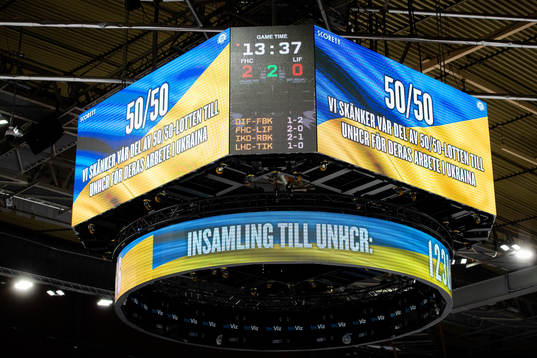 The jumbotron showing a message about tonights 50/50
