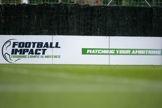 A sign with the logo of Football impact