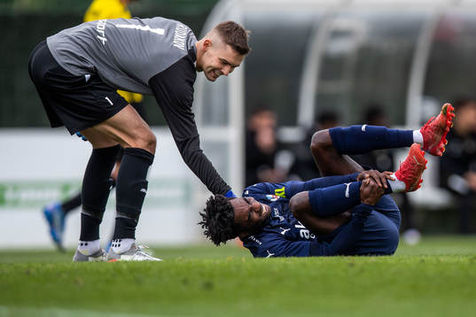 Goalkeeper Maksim Rudakov of Honka and Benjamin Acquah of