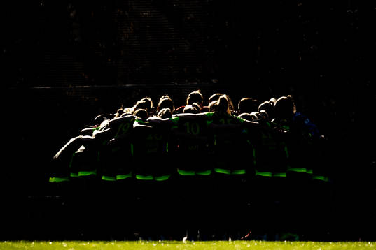 Players of Brann gather in a circle