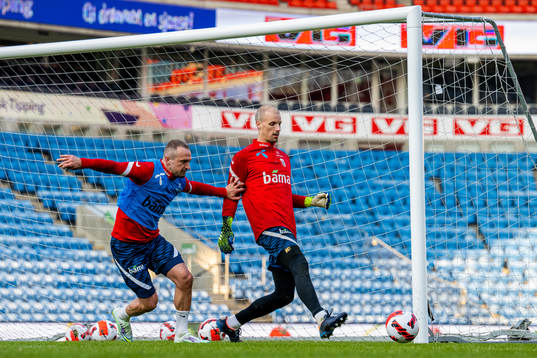 Veton Berisha and goalkeeper André Hansen of the Norwegian