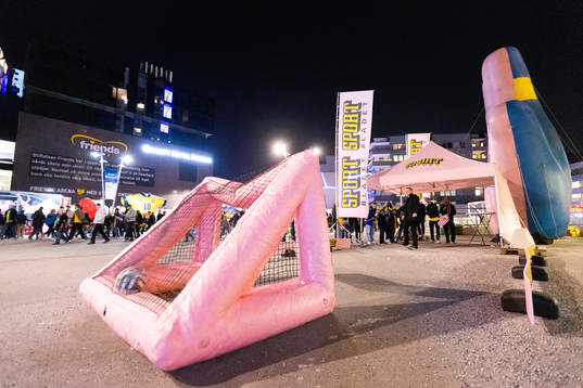 A supporter scoring a goal outside Friends arena