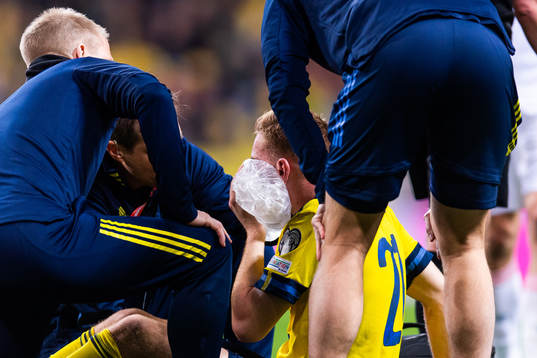 Dejan Kulusevski of Sweden with an ice pack against his