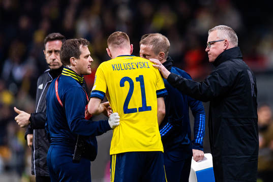 head coach Janne Andersson attends to Dejan Kulusevski of