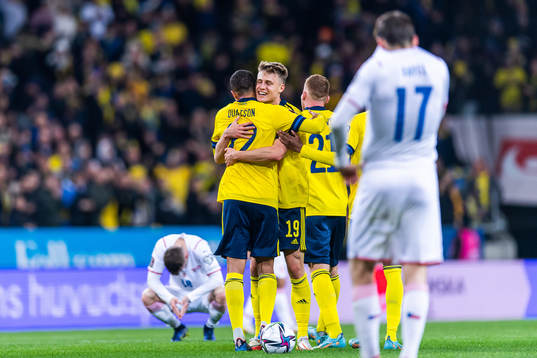 Mattias Svanberg and Robin Quaison of Sweden celebrate