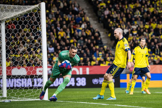 goalkeeper Robin Olsen and Marcus Danielson of Sweden