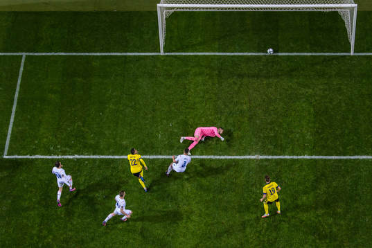 Robin Quaison of Sweden scores the 1-0 goal behind