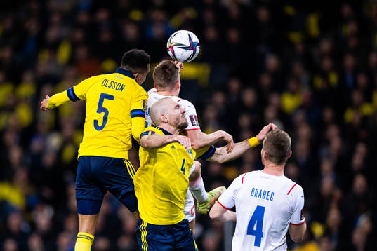 Martin Olsson and Marcus Danielson compete for the ball