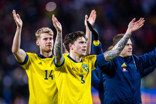 Filip Helander and Victor Lindelöf of Sweden celebrate