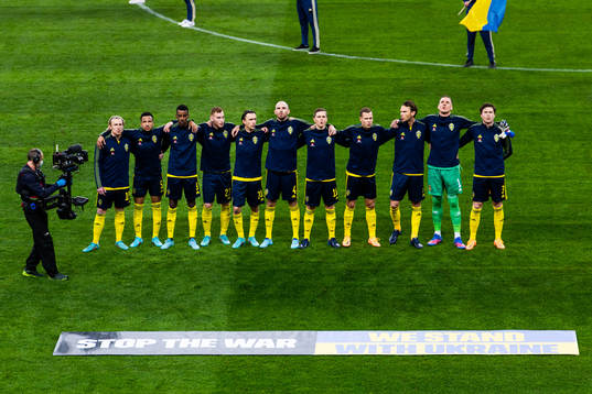 Players of Sweden participate in a manifestation against