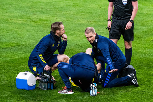 Dejan Kulusevski of Sweden receives medcial attention