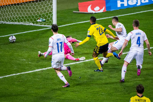Robin Quaison of Sweden scores 1-0 behind goalkeeper Tomas