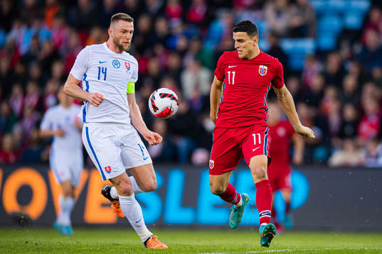 Milan Škriniar of Slovakia and Mohamed Amine Elyounoussi