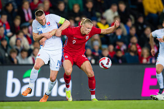 Milan Škriniar of Slovakia and Erling Braut Haaland of