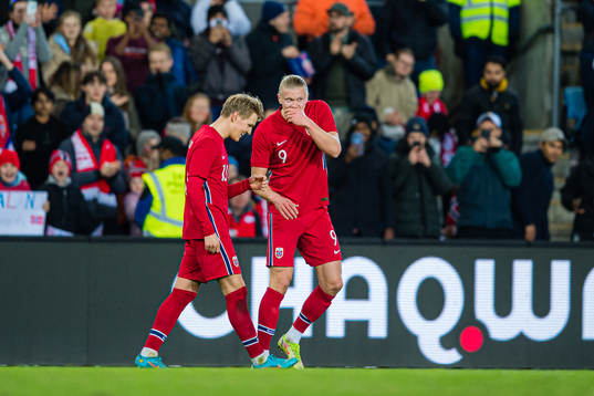 Martin Ødegaard of Norway celebrates with Erling Braut