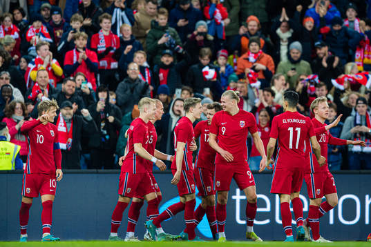 Martin Ødegaard of Norway celebrates with Erling Braut