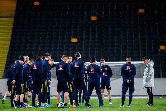 Players of Sweden and head coach Janne Andersson