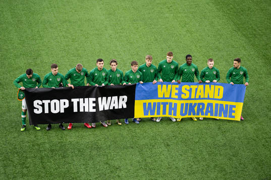 Players of Ireland with a banner