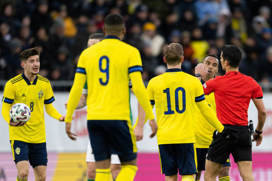 Armin Gigovic and Bilal Hussein of Sweden react