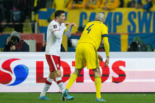 Robert Lewandowski of Poland ans Marcus Danielson of Sweden