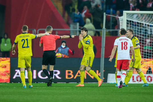 referee Daniele Orsato awards a penalty shot to Poland