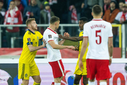 Krystian Bielik of Poland against Alexander Isak of Sweden