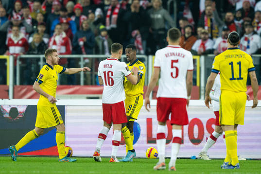 Krystian Bielik of Poland against Alexander Isak of Sweden