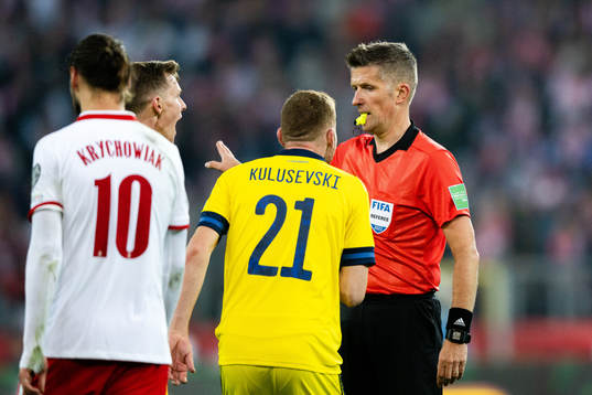 Dejan Kulusevski of Sweden and referee Daniele Orsato